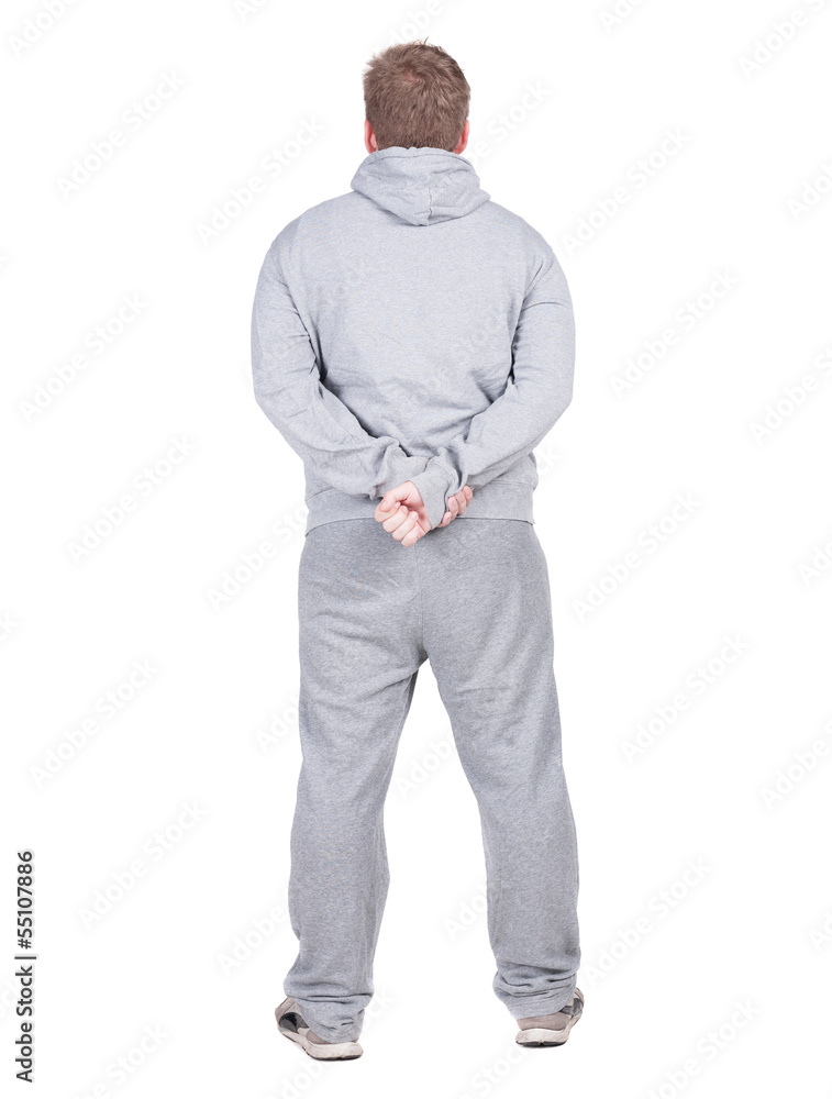 Back view of young sportsman in duffle looks away. Back view of young sportsman in duffle looks away.