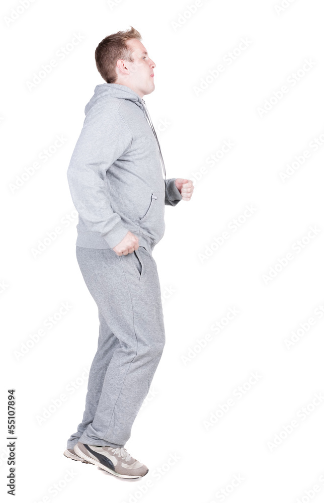 back view of running athlete man in tracksiut .