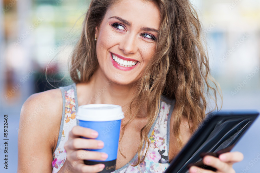 Woman with digital tablet and coffee