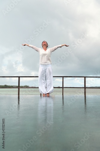 young woman relax on cloudy summer day