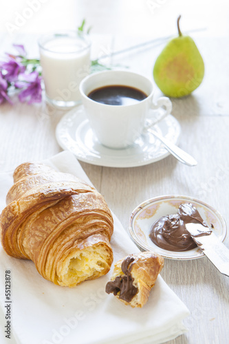 Croissants with chocolate, milk and coffee, delicious breakfast