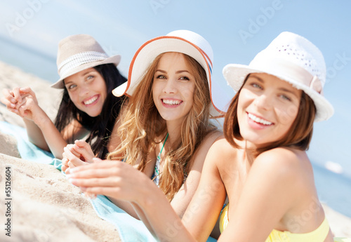 girls sunbathing on the beach