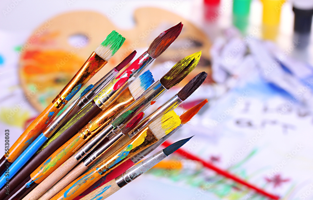 Many brush in paint on bright background Many brush in paint on bright background