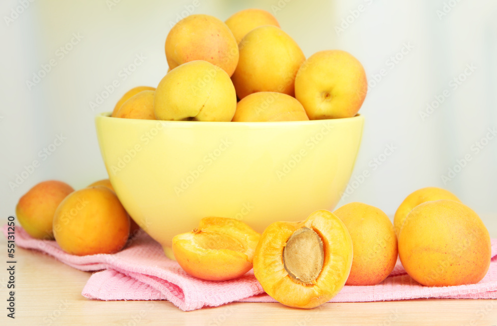 Fresh natural apricot in bowl on table in kitchen Fresh natural apricot in bowl on table in kitchen