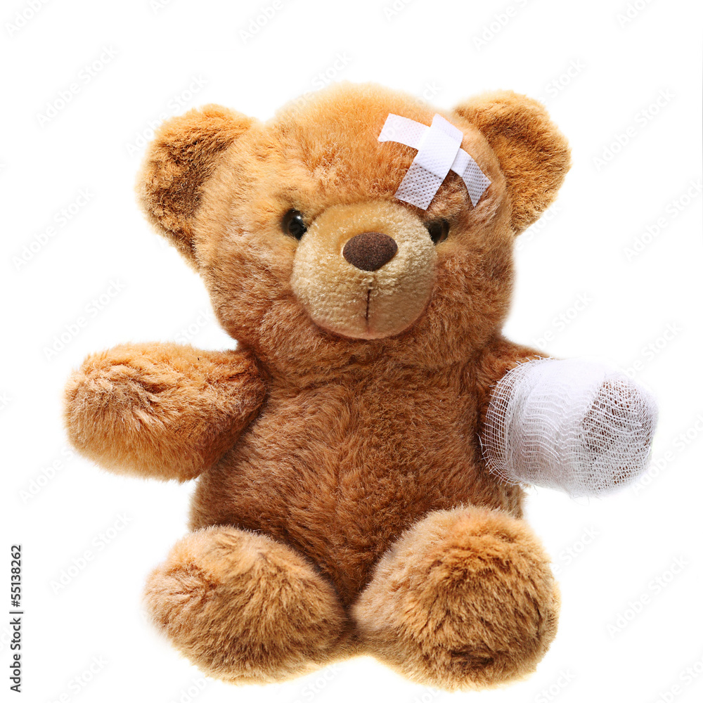 Fototapeta premium Classic teddy bear with bandages isolated on white background