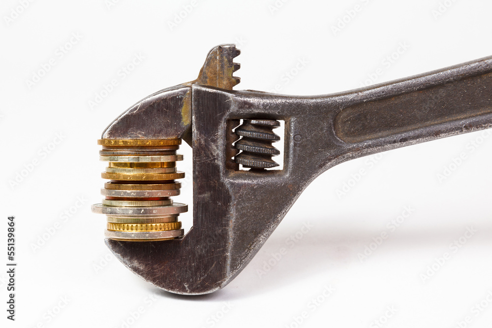 wrench and coins wrench and coins