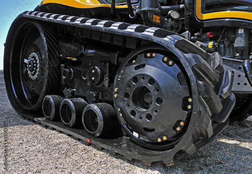 new black excavator outside with rubber crampons photo