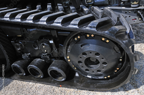 new black excavator outside with rubber crampons