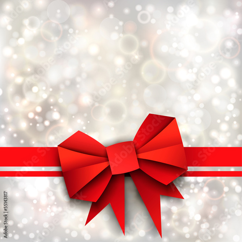 Gift paper red bow and ribbon on silver background