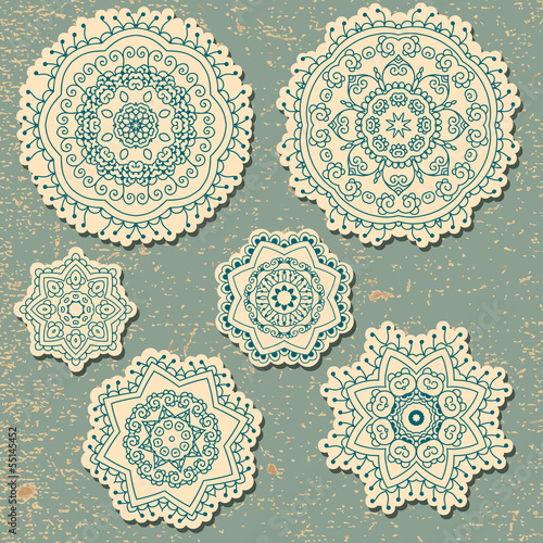 Vintage card with lace ethnic ornament in a circle