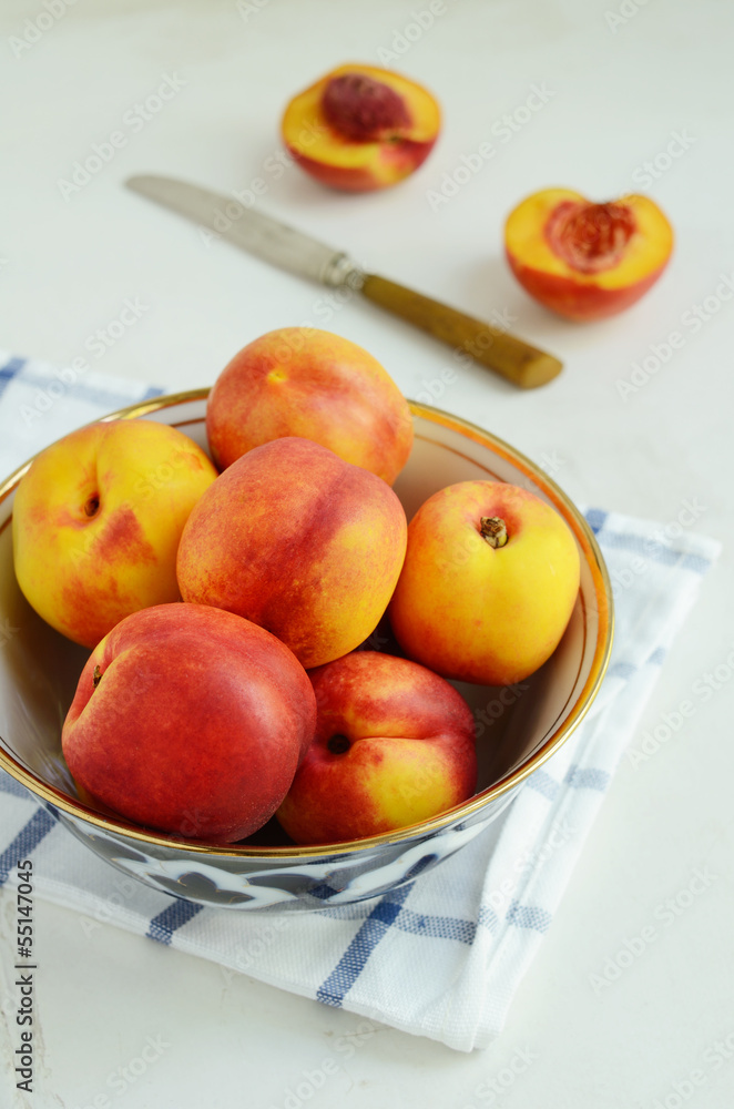 Ripe nectarines in oriental bowl Ripe nectarines in oriental bowl
