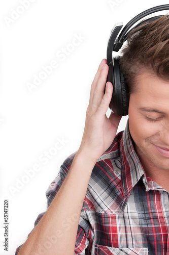 Man in headphones. Cropped image of handsome young man in headph