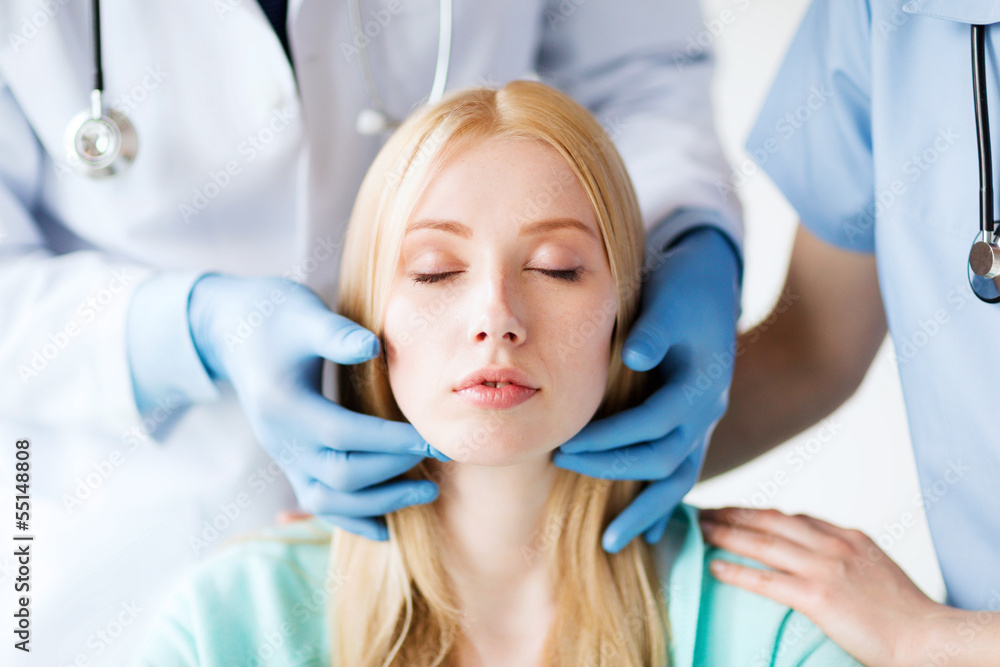 Fototapeta premium plastic surgeon or doctor with patient