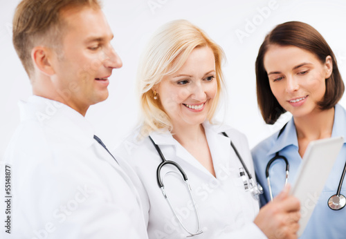 doctors looking at tablet pc