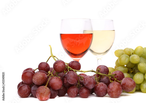 glasses of wine and ripe grapes