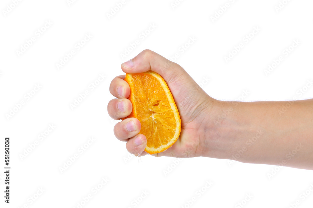 Hand squeezing an orange Hand squeezing an orange