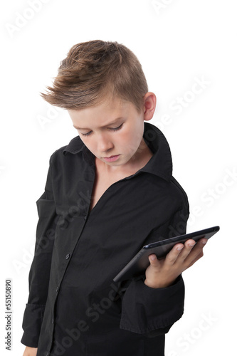 Boy holding tablet isolated on white.