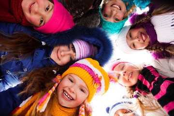 Circle of happy kids outside