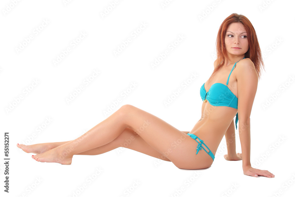 sexy woman in a blue bathing suit on a white background