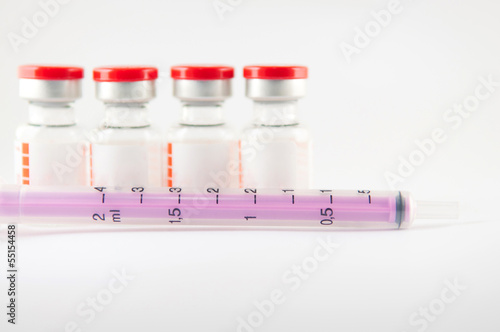 Purple disposable syringe and injection vials