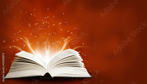 Opened magic book with magic light © ninared