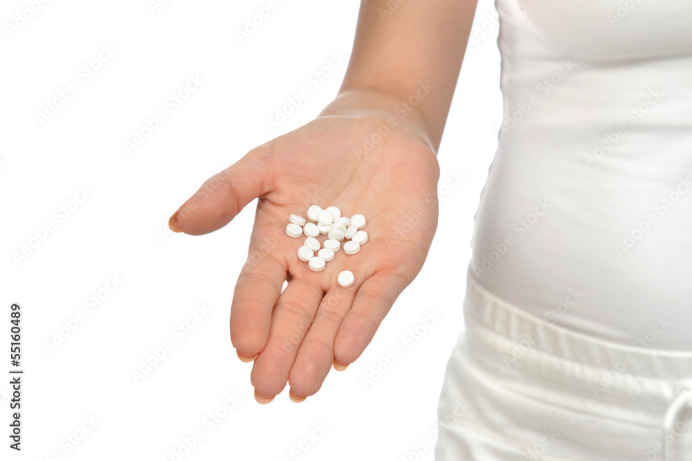 Hand holding on open palm painkiller pill tablets medicine Hand holding on open palm painkiller pill tablets medicine