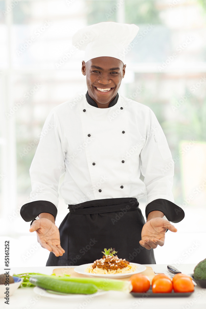 male african chef presenting spaghetti male african chef presenting spaghetti