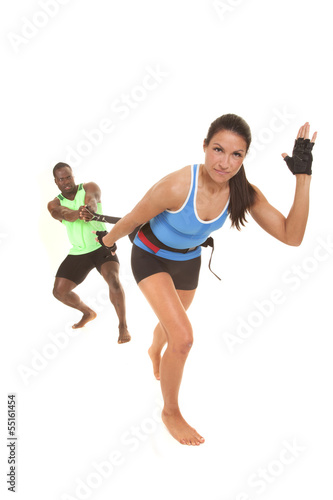 man training woman runner looking