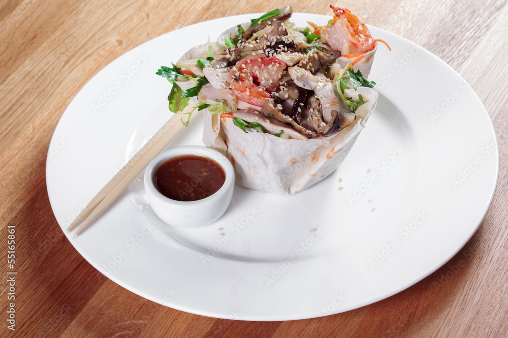 Snack on the white plate.