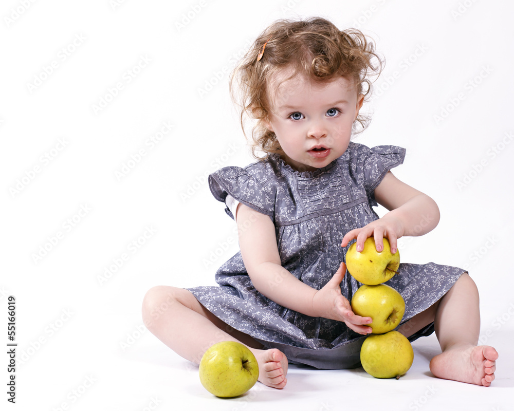 Fototapeta premium Little girl with apples