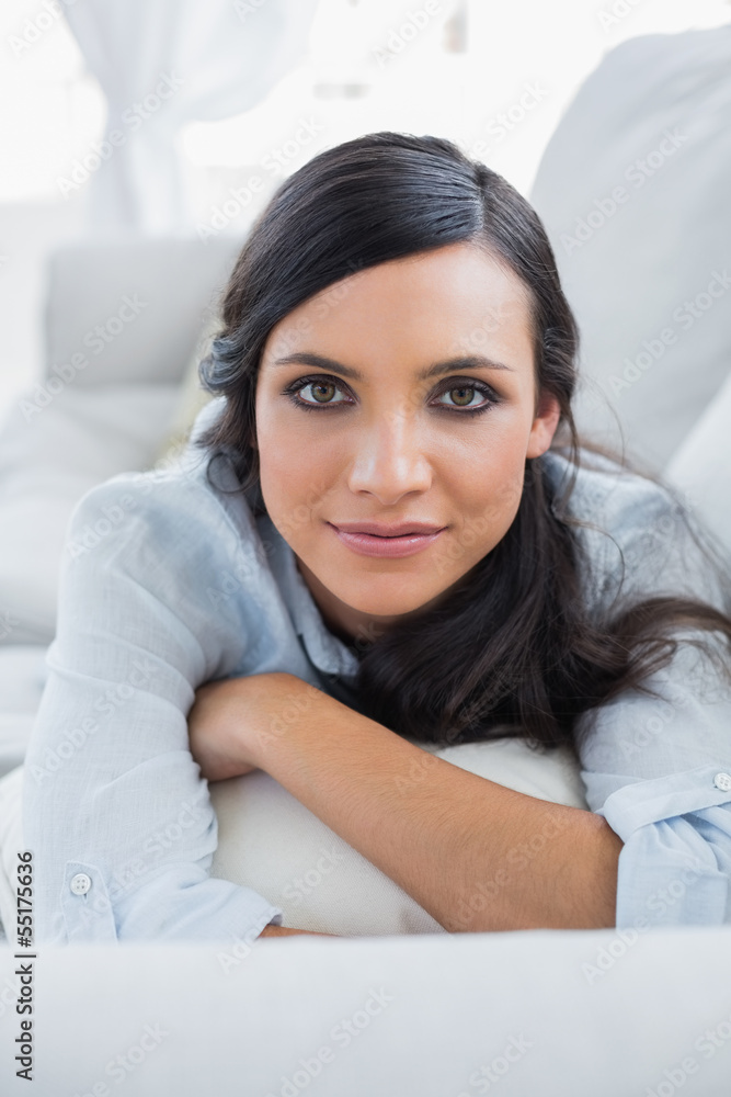 Peaceful dark hair woman lying on the couch Peaceful dark hair woman lying on the couch