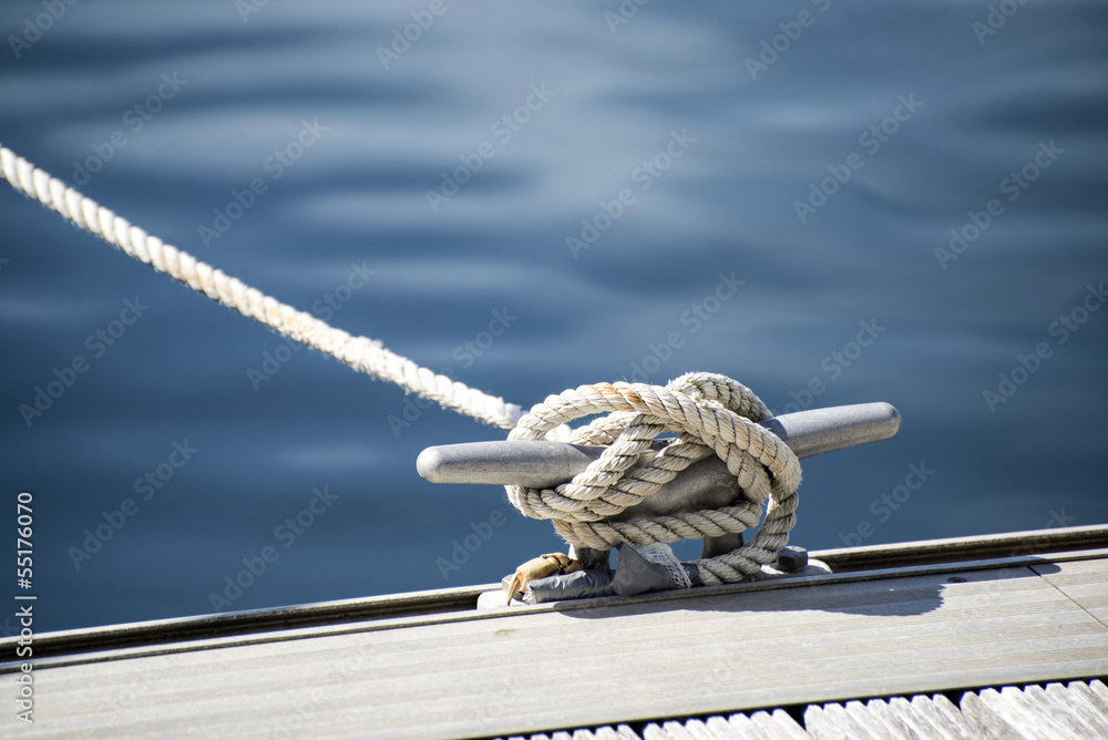 Detail image of yacht rope cleat on sailboat deck - obrazy, fototapety, plakaty 