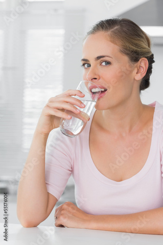 Attractive woman drinking water