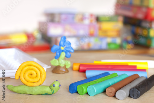 Plasticine on table with snail abstract background concept