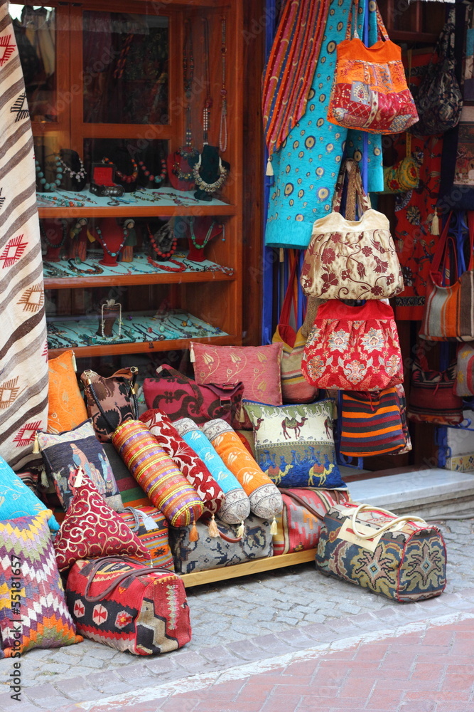 Fabrics, textiles,bags and turkish rugs at a bazaar in Turkey