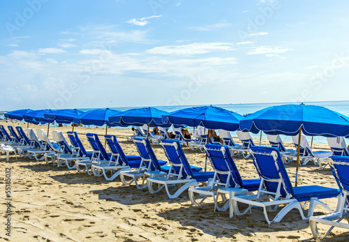 beach umbrella with couch colorful in the sand