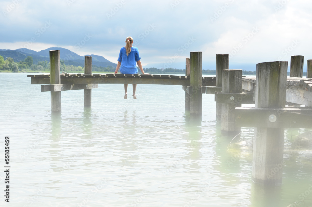 Girl on the wooden jetty. Switzerland Girl on the wooden jetty. Switzerland