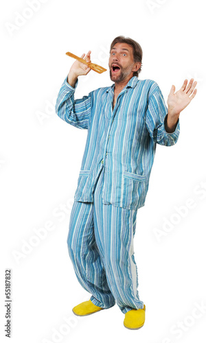 man in pajamas singing