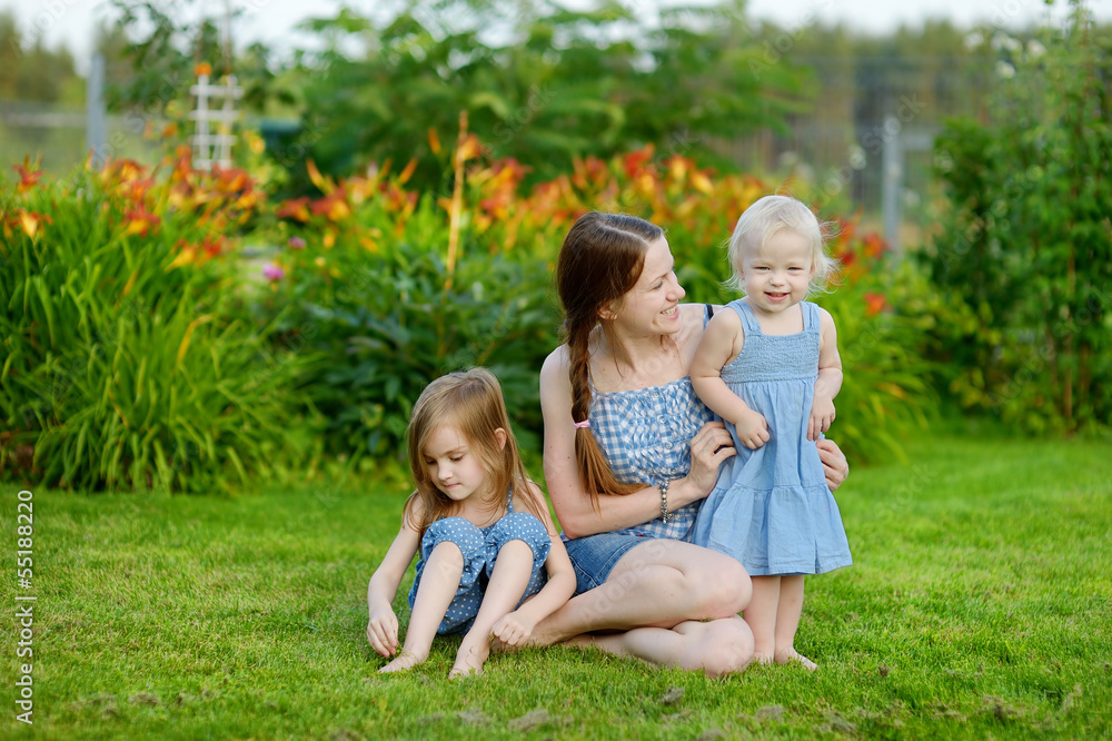 Young mother and her two daughters Young mother and her two daughters