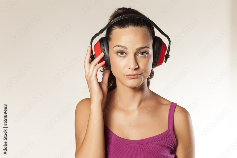 beautiful wierd young brunette posing with anti loud headset beautiful wierd young brunette posing with anti loud headset