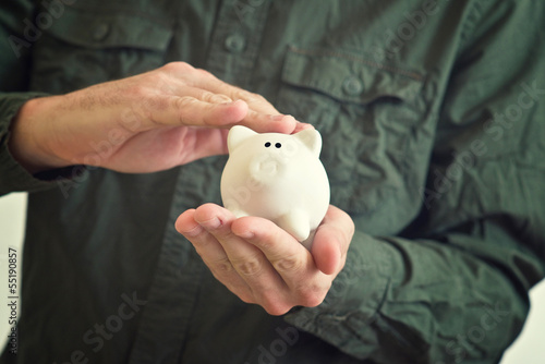 Piggy coin bank in hands