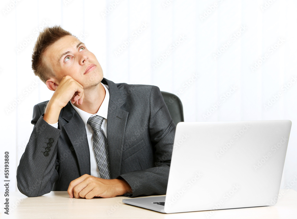 Portrait of young businessman in office Portrait of young businessman in office