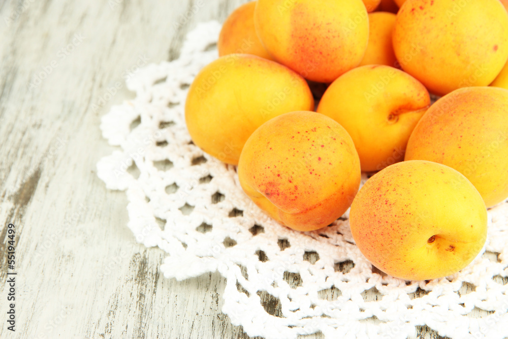 Fresh natural apricot on wooden table close up