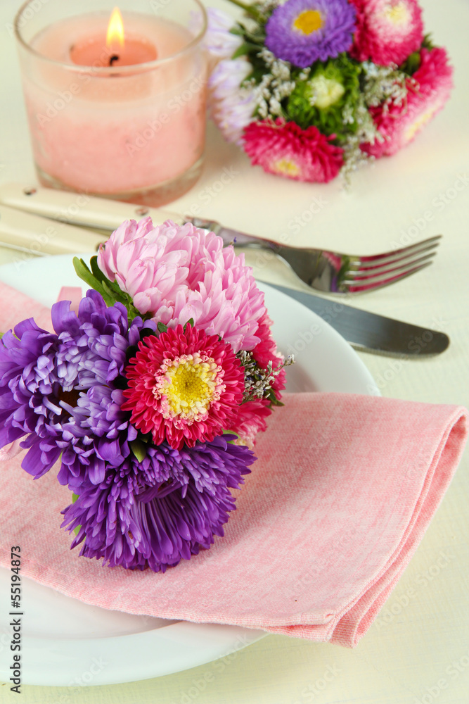 Festive dining table setting with flowers