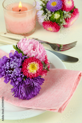 Festive dining table setting with flowers