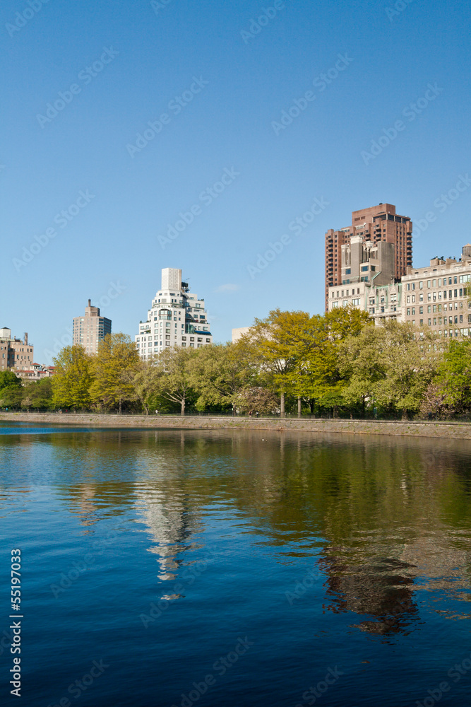 Central Park Lake and buildings in New York City, USA