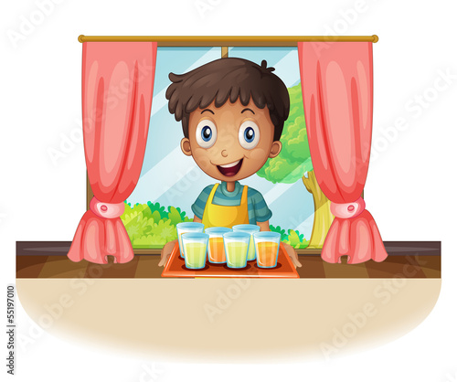 A boy holding a tray of juice