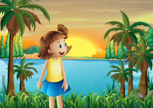 A small girl at the riverbank