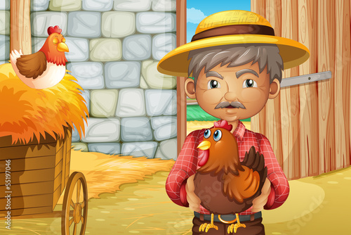 An old man holding a rooster inside the barnhouse