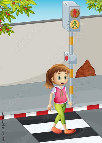 A young lady at the pedestrian lane